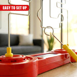 Red plastic console holding a flexible metal grid and a yellow buzzer handle.