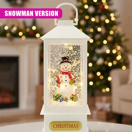 White lantern decoration features an illuminated snowman surrounded by falling simulated snow.