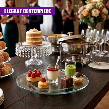 Clear glass lazy susan displaying small treats such as mini cakes, tarts, and desserts.