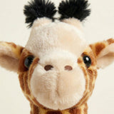 Close-up view of a plush giraffe head featuring mottled brown and tan patterned fabric and tufts.