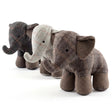 A row of four stuffed elephants featuring various gray and brown plaid patterns.