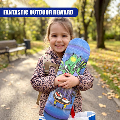 A smiling girl holds a colorful skateboard designed with green, blue, and black cartoon characters.