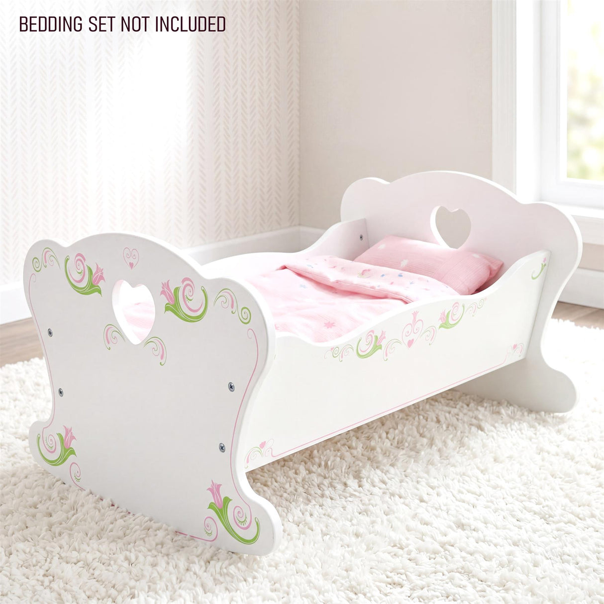 White wooden doll crib with heart cutouts, featuring pink and green floral accents.