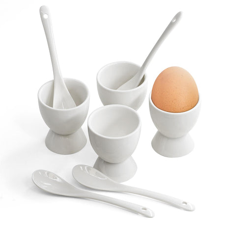 White egg cups and spoons displayed in a shop.