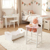 White wooden doll high chair and cradle set displayed with a porcelain doll seated in the chair.