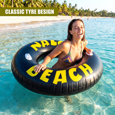 Large black inflatable ring with yellow text shown in clear, blue tropical ocean water.