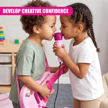 Two young children interact, playing with a pink guitar and a matching microphone.