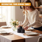 A woman in a dining room, setting the table with a tablecloth, plates, and a centerpiece. She is placing a salt and pepper shaker set on the table. - UKBuyZone