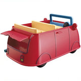 Red toy vehicle with molded body compartments, yellow accessories, and a blue carrying handle.