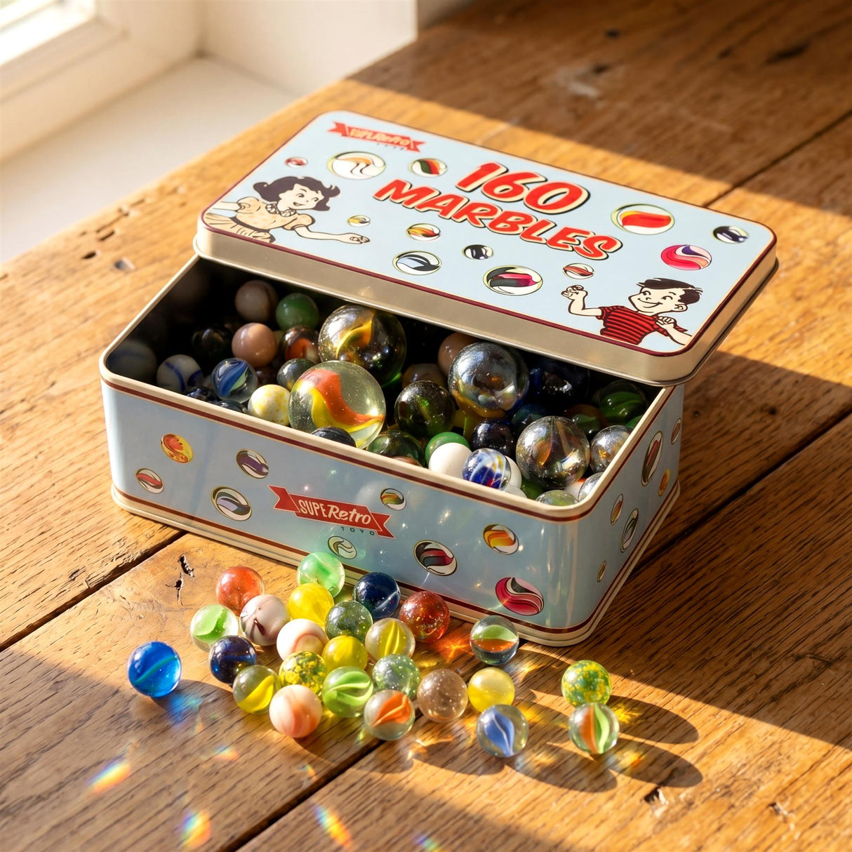 An open metal tin box holds many mixed colored glass marbles on a wooden surface.