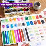 A wooden box of colored pencils rests near various sheets of paint and color gradient swatches.