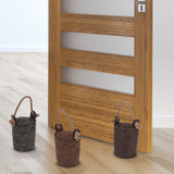 Brown and white faux leather door stopper on a plain white wall. - UKBuyZone