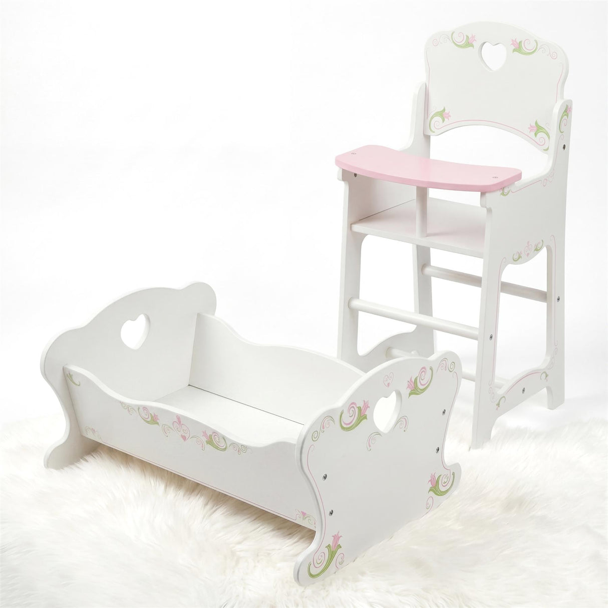 White wooden dolls cradle and high chair set with decorative painted detailing.
