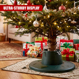An adjustable Christmas tree stand holding a decorated tree with presents underneath