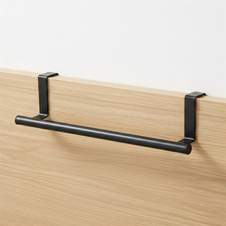 Black horizontal rail supported by brackets, mounted to a light wood paneling surface.