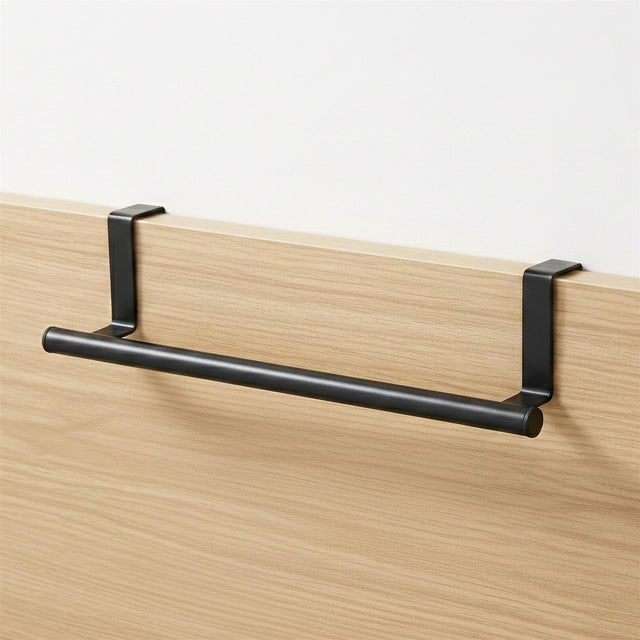 Black horizontal rail supported by brackets, mounted to a light wood paneling surface.