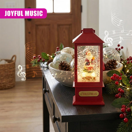 Red holiday lantern displaying a lit Santa figure surrounded by snow and festive decorations.