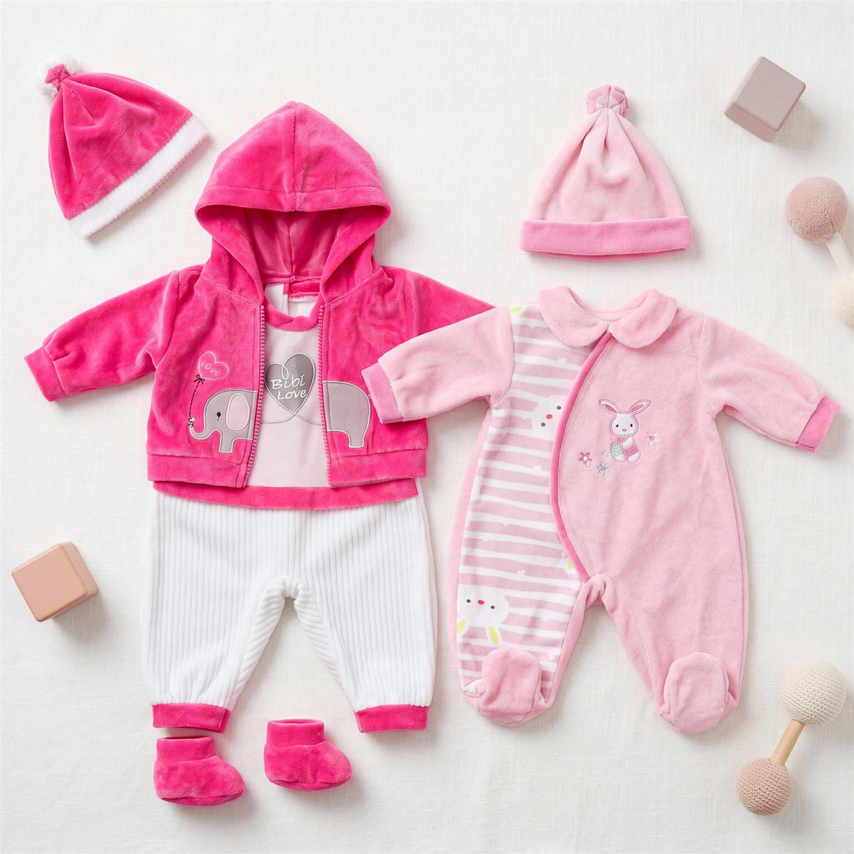Set of two plush doll clothing outfits, featuring pink and white elephant graphics and stripes.