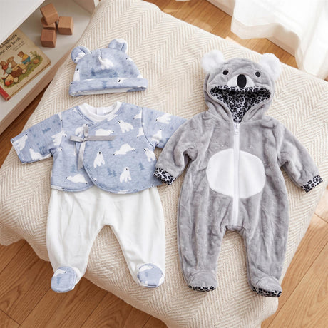 Two doll outfits: one blue with polar bears, and one gray hooded bear jumpsuit.