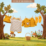 Clothesline displays three baby outfits—yellow, patterned, and yellow sweater—hung outdoors on grass.