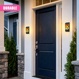Two decorative outdoor lanterns with patterned glass are mounted on the wall beside the dark entryway door.