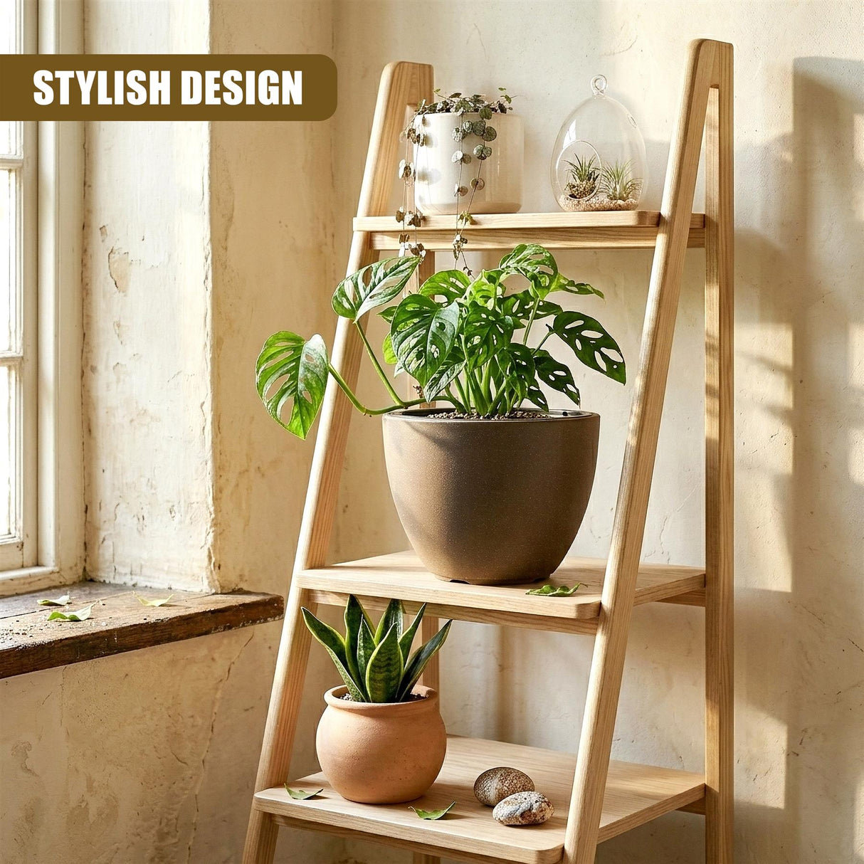 A large, oval gray pot holding green foliage sits on a natural wood tiered plant stand.