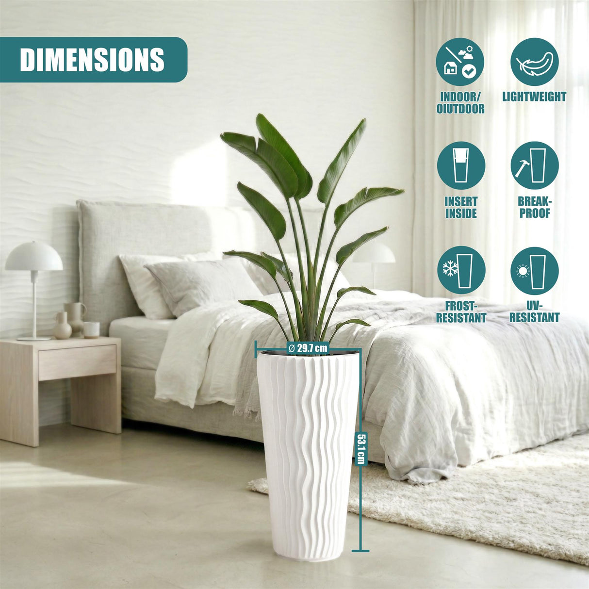 White, fluted cylindrical flower pot displayed with dimensions in a styled bedroom setting.