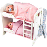 "Baby dolls in a mini bed with a pink comforter and white frame." - UKBuyZone