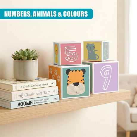 Colorful stacking blocks showing numbers and animals are displayed with books and a potted succulent plant.
