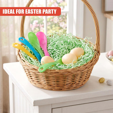 Woven basket holding green shredded filler, colorful plastic spoons, and several decorative artificial eggs.