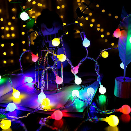 Colorful string lights with berries.