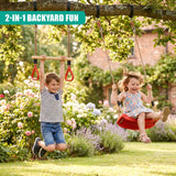 Swing and trapeze bar set in use by two children hanging from a branch in a garden.