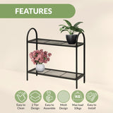 Black metal plant stand with two shelves.