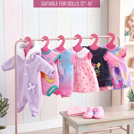 Six hanging doll clothes are displayed on a rack, accompanied by pink doll shoes and accessories.