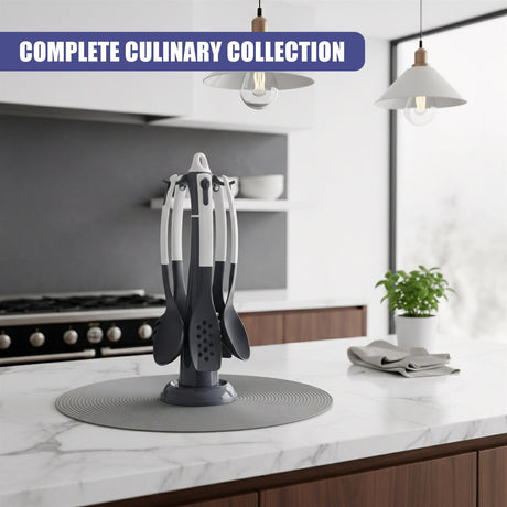 Six kitchen utensils, including spatulas and whisks, rest upright on a round gray base mat.