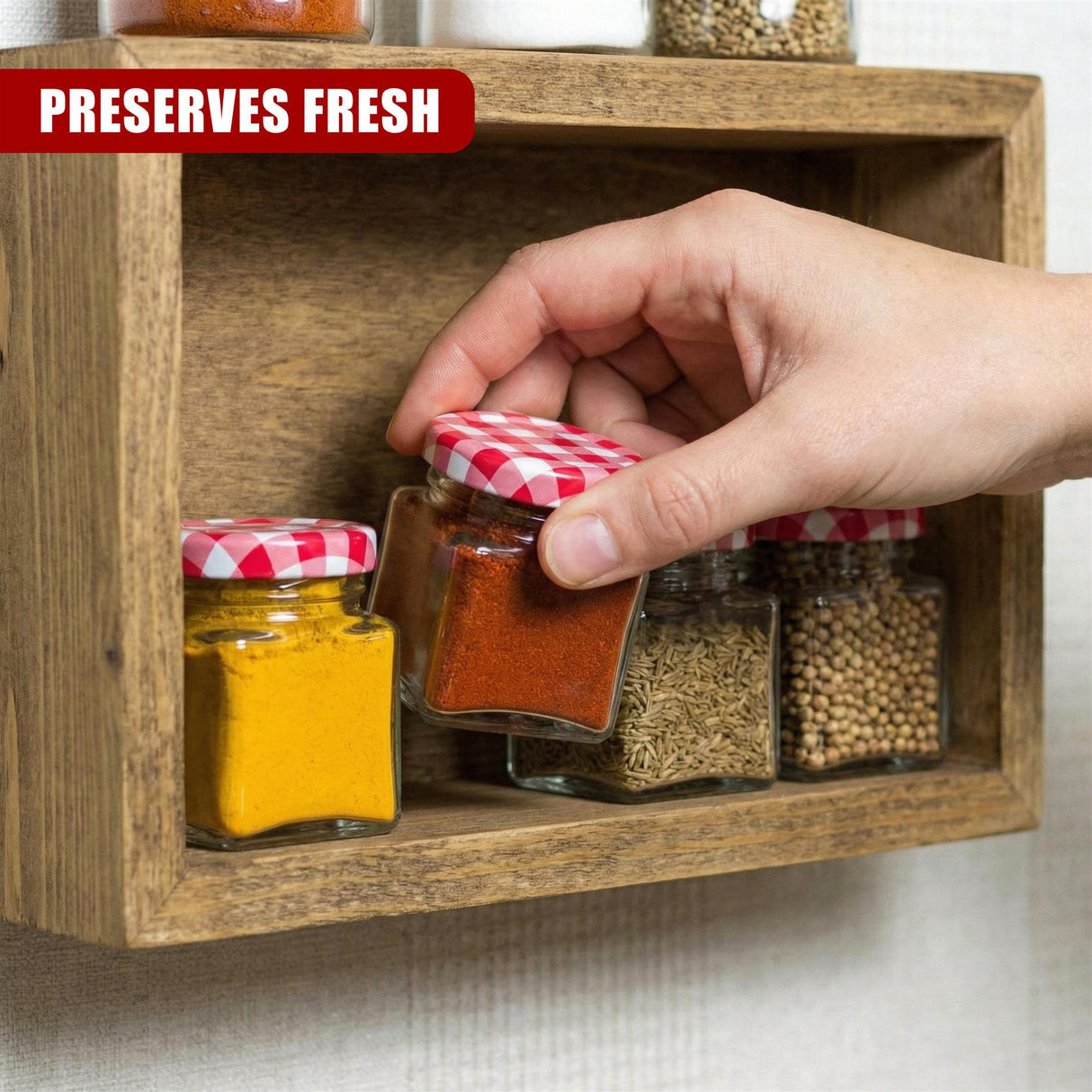 A hand displays a spice jar in a wooden rack with multiple filled spice containers.