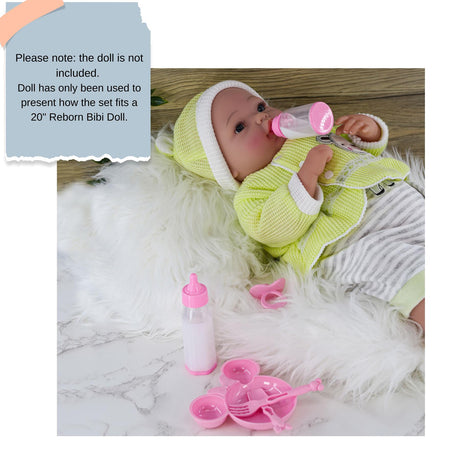 Doll displayed with a feeding accessory set, including bottles, pacifier, and small pink plates.