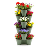 A stack of small gray planters holding multiple potted colorful artificial flowering plants.
