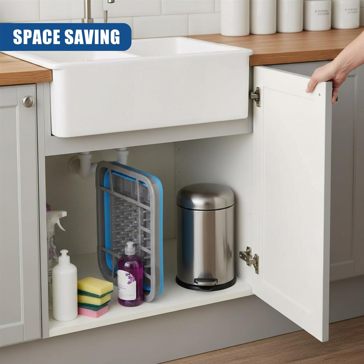 Open cabinet under the sink reveals a draining rack, various cleaning supplies, and a metal container.