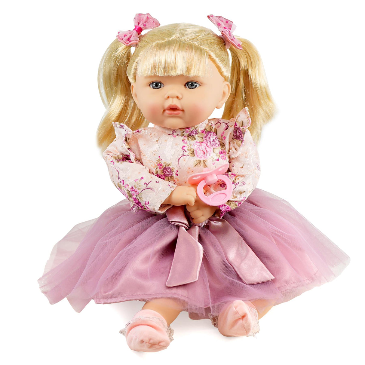 Small doll in a pink dress and headband.