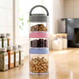 Clear stackable pot holds layered snacks: nuts, dark ingredients, and cashews.