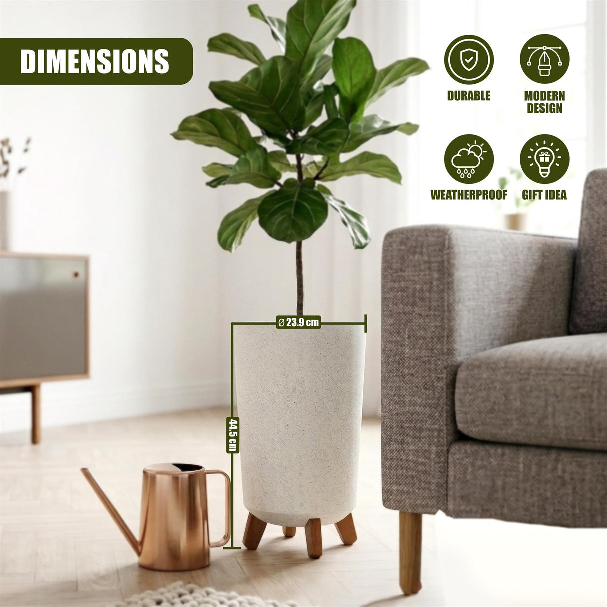 Indoor tropical plant in a light-colored, cylindrical pot with short wooden legs on the floor.