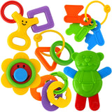 Colorful baby teething toys including rings, smiling faces, blocks, and a green animal figure.