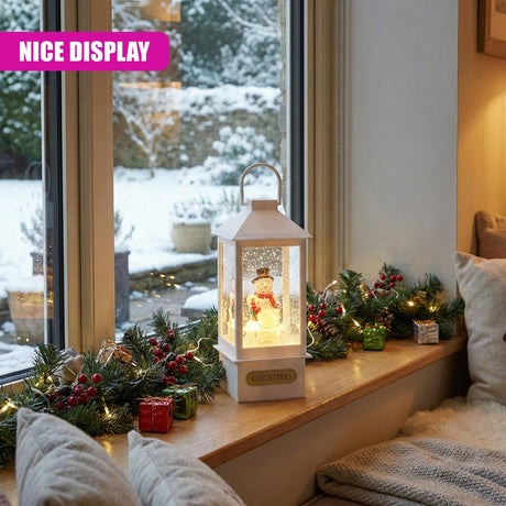 Lighted lantern displaying a Santa figurine on a mantelpiece with festive evergreen branches and berries.