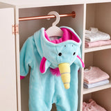 Plush blue elephant onesie with pink lining and yellow trunk hangs on a rack in a white closet.