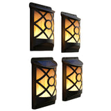 Three black metal wall sconces featuring cut-out glass panels with glowing simulated flame light.