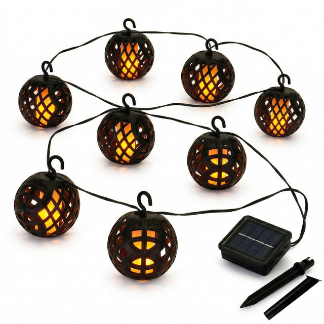 String of woven rattan globe solar lights connected to a small rectangular solar power panel.
