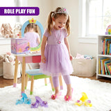 Blue and purple plastic shoes and various pink and yellow play jewelry items arranged on a rug.