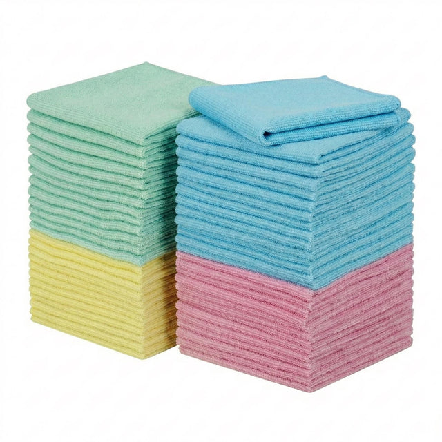 Three neat stacks of folded microfiber cloths in mint green, light blue, and blush pink.