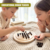 Two children play with a wooden solitaire board and dark circular tokens.